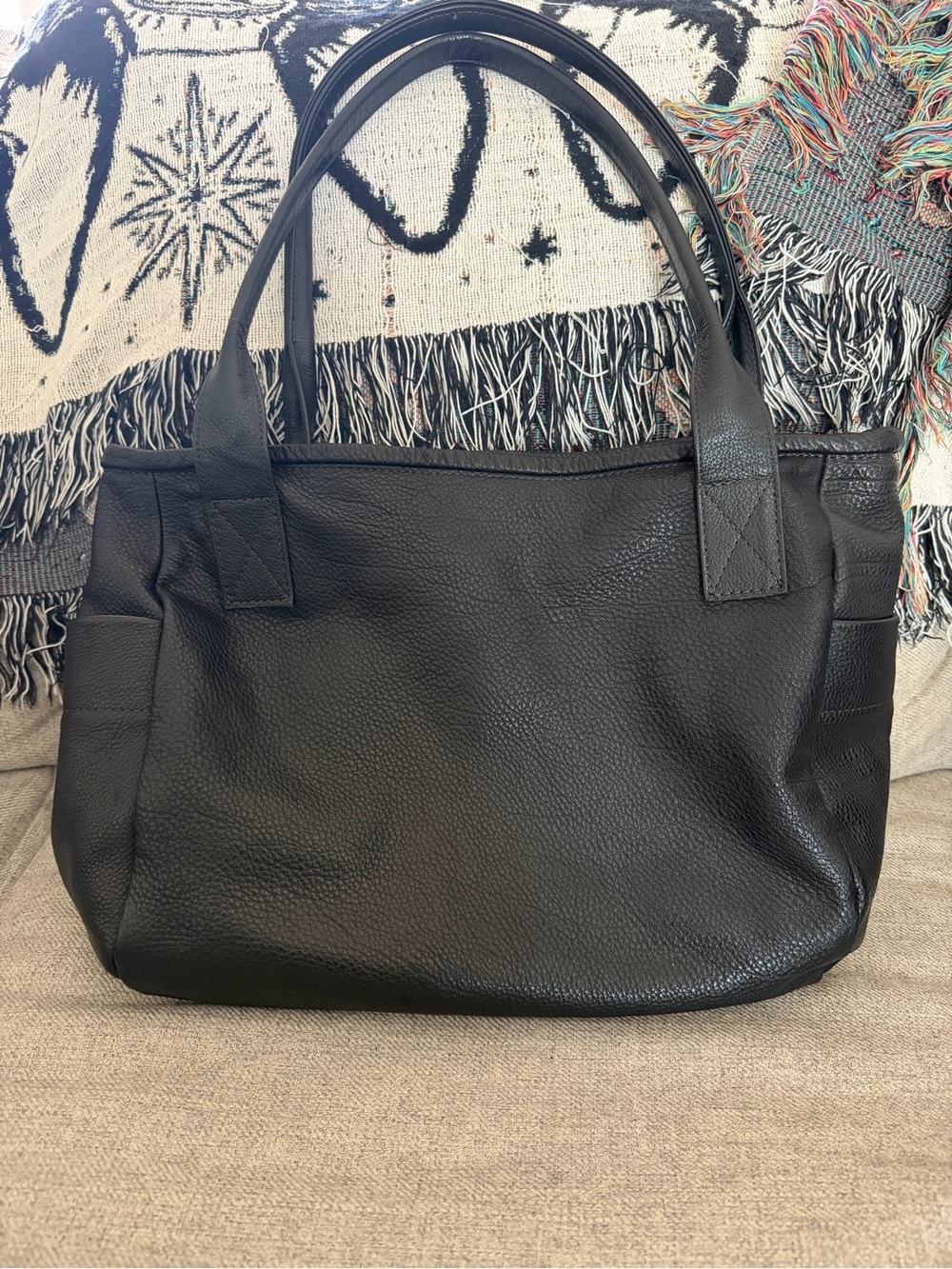 Rough and tumble honed black bucket tote
